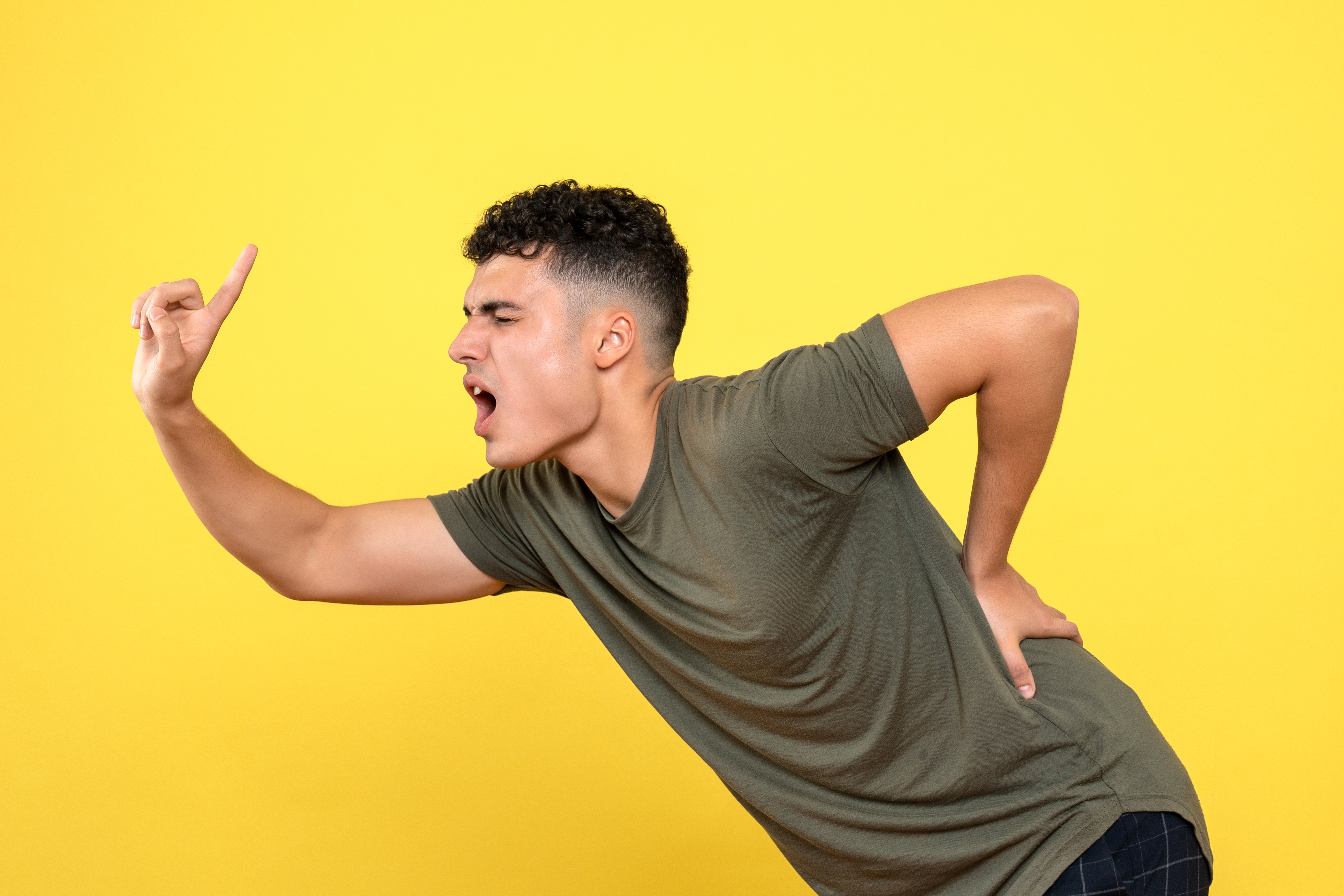 front-view-man-with-terrible-backache-points-up.jpg